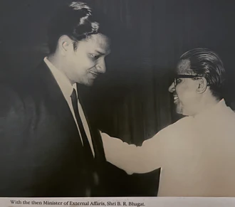 Black and white portrait: Ajay Rungta shaking hands with Shri B. R. Bhagat, then India's Minister of External Affairs.