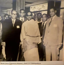 Sepia photo: Ajay Rungta (Dadu, right) with Minister Prof. D.P. Chattopadhyay and others at an official event.