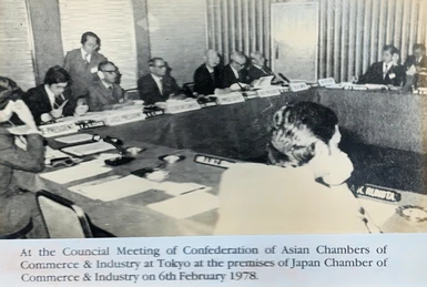 Ajay Rungta (K. Rungta nameplate) at CACCI council meeting, Tokyo 1978. Men sit around a conference table.
